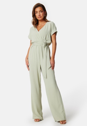 Läs mer om BUBBLEROOM Front Wrap Jumpsuit Dusty green XS