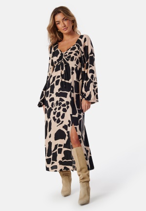 Läs mer om BUBBLEROOM Puff Sleeve Midi Dress Black/Patterned XS