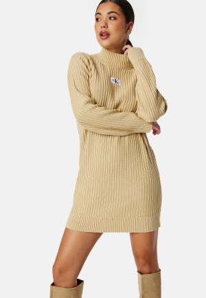 Läs mer om Calvin Klein Jeans Washed Monologo Sweater Dress AAT Warm Sand M