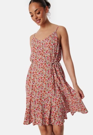 Läs mer om Pieces Pcnya Slip Button Dress Cloud Dancer AOP:FLOWER L